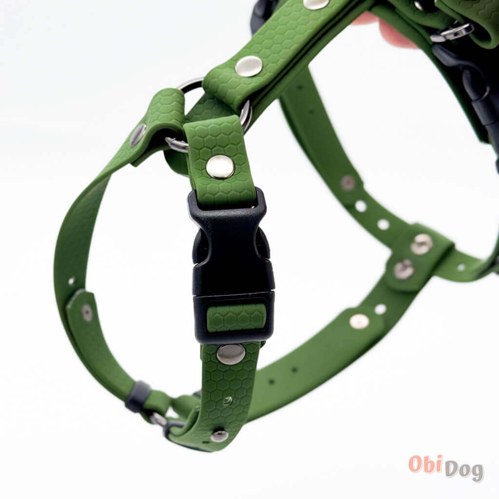 Anatomically correct waterproof dog harness in green, featuring a secure closure and durable design.